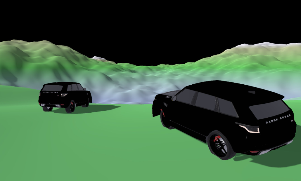 Two cars looking off into the distant mountain roads